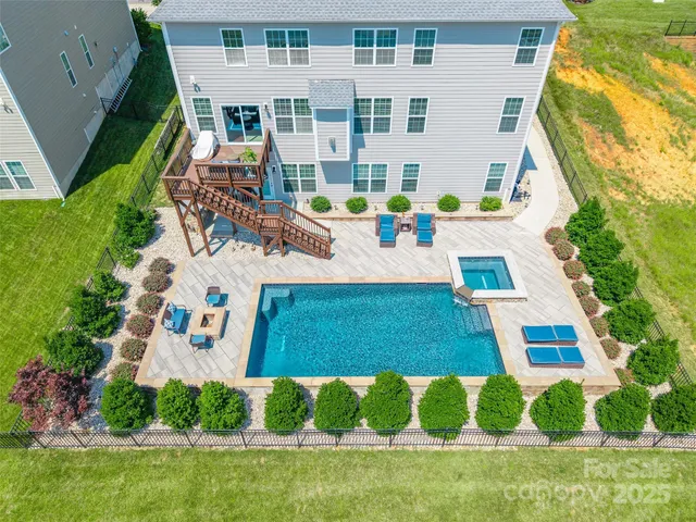 a view of a backyard with sitting area