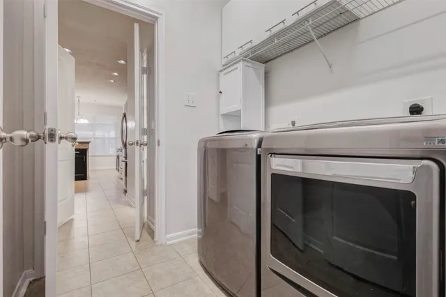 a utility room with washer and dryer