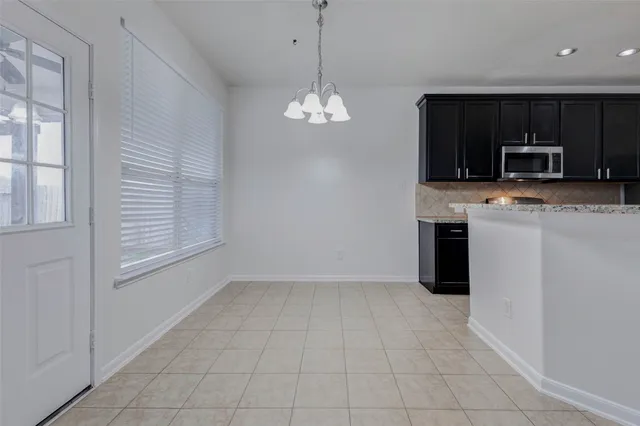 a view of a kitchen with a sink dishwasher and microwave