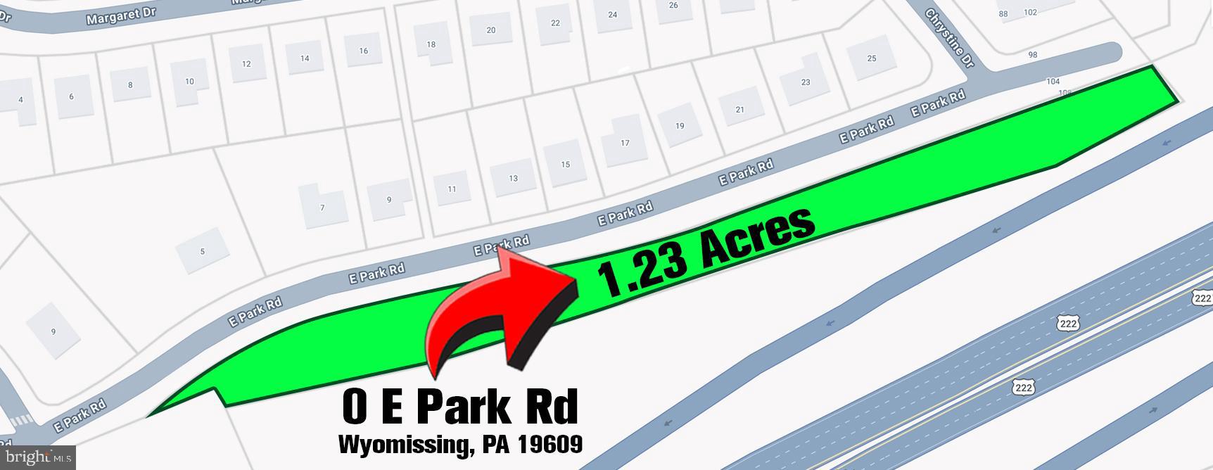 a view of a street with a park