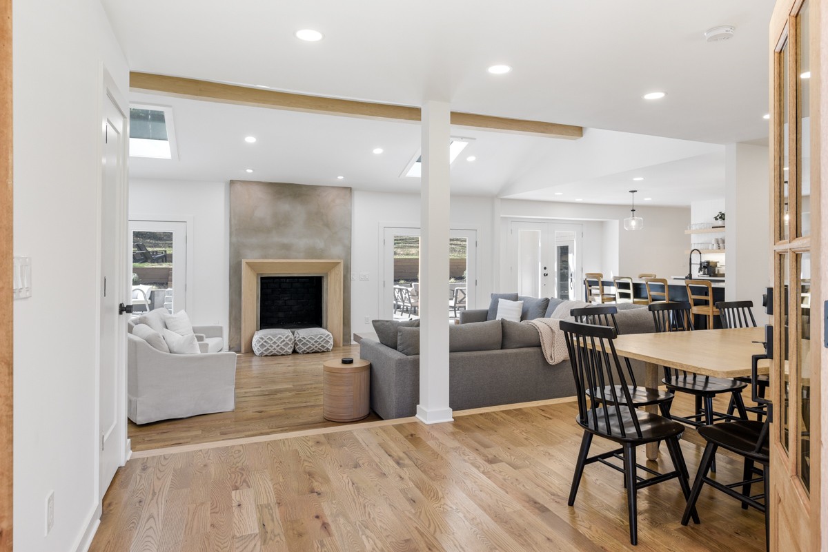 270 Hurt Road Hendersonville, TN 37075 - Photo 11 of 68 a living room with furniture a fireplace and a dining table with kitchen view