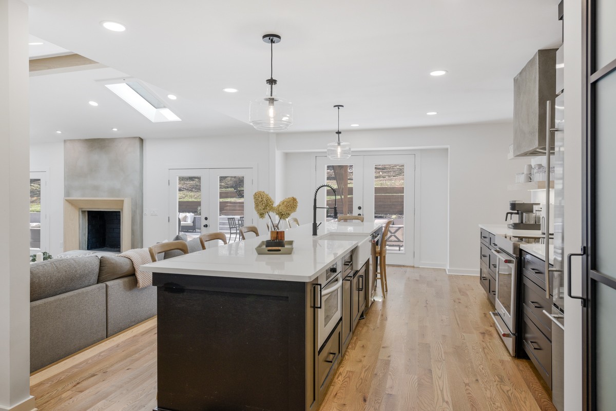 270 Hurt Road Hendersonville, TN 37075 - Photo 24 of 68 a open kitchen with stainless steel appliances granite countertop a refrigerator a sink dishwasher a oven and a dining table with wooden floor