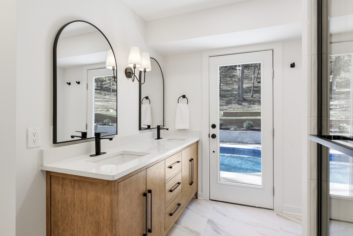270 Hurt Road Hendersonville, TN 37075 - Photo 37 of 68 a bathroom with a double vanity sink and a mirror