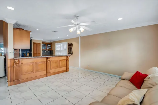 a kitchen with stainless steel appliances granite countertop a sink and cabinets