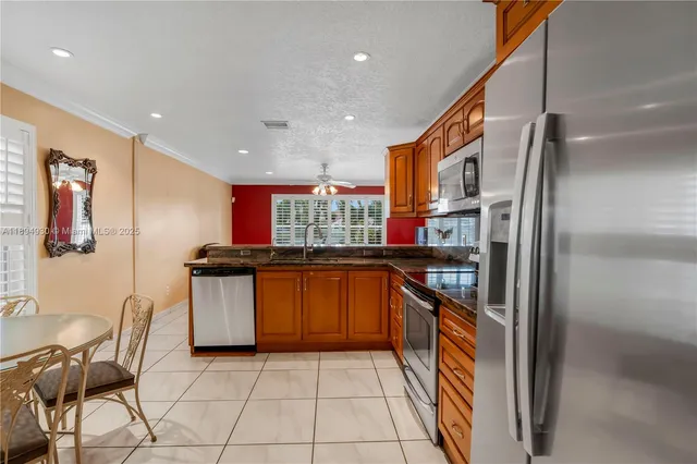 a dining room with furniture a chandelier and window