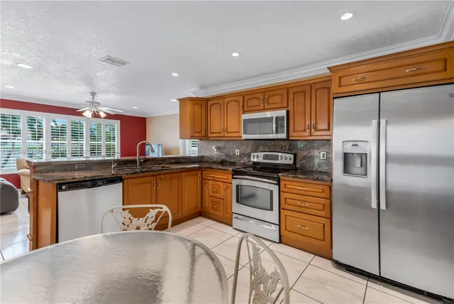 a bedroom with bed and a chandelier