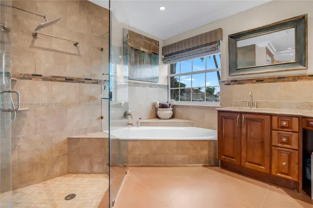 an empty room with a chandelier fan