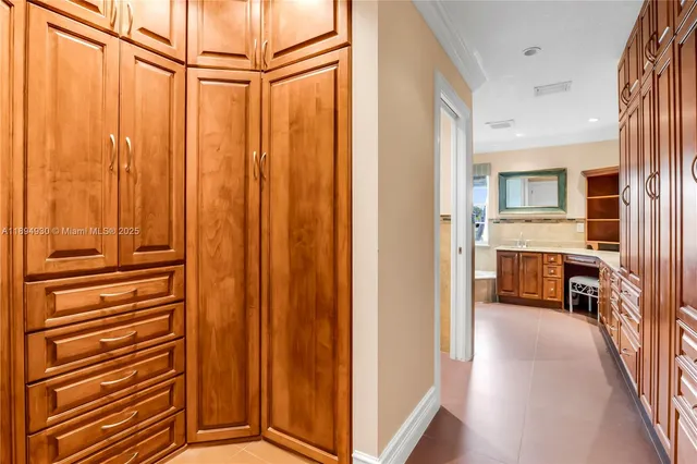 a view of a room with a ceiling fan