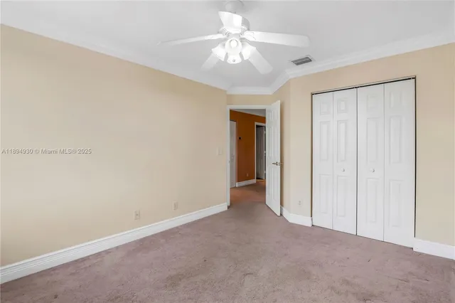 a white toilet sitting next to a bathtub