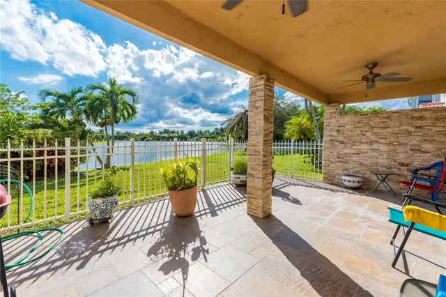 a view of a lake with houses in the back