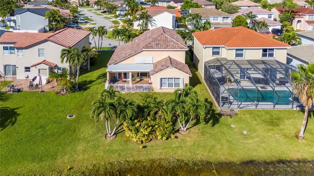 an aerial view of a house with a ocean view
