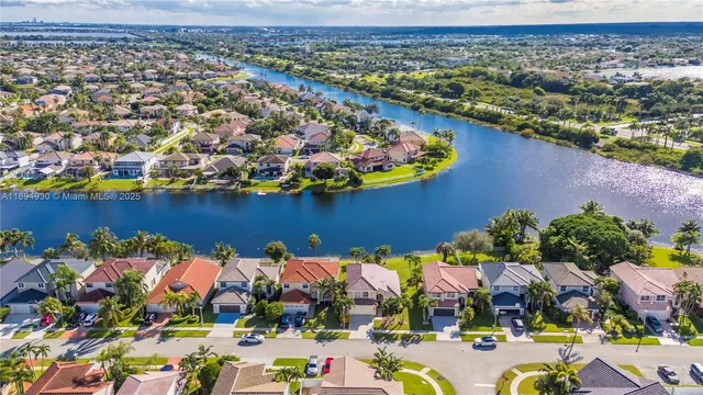 an aerial view of multiple houses with yard