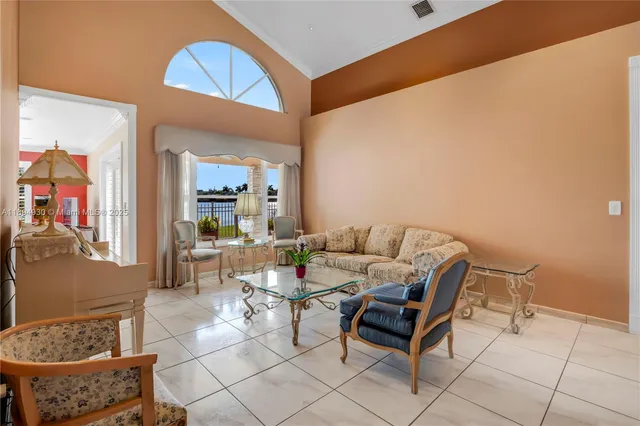 a living room with furniture and a rug