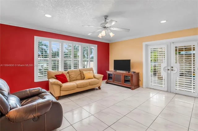 a living room with furniture and a flat screen tv