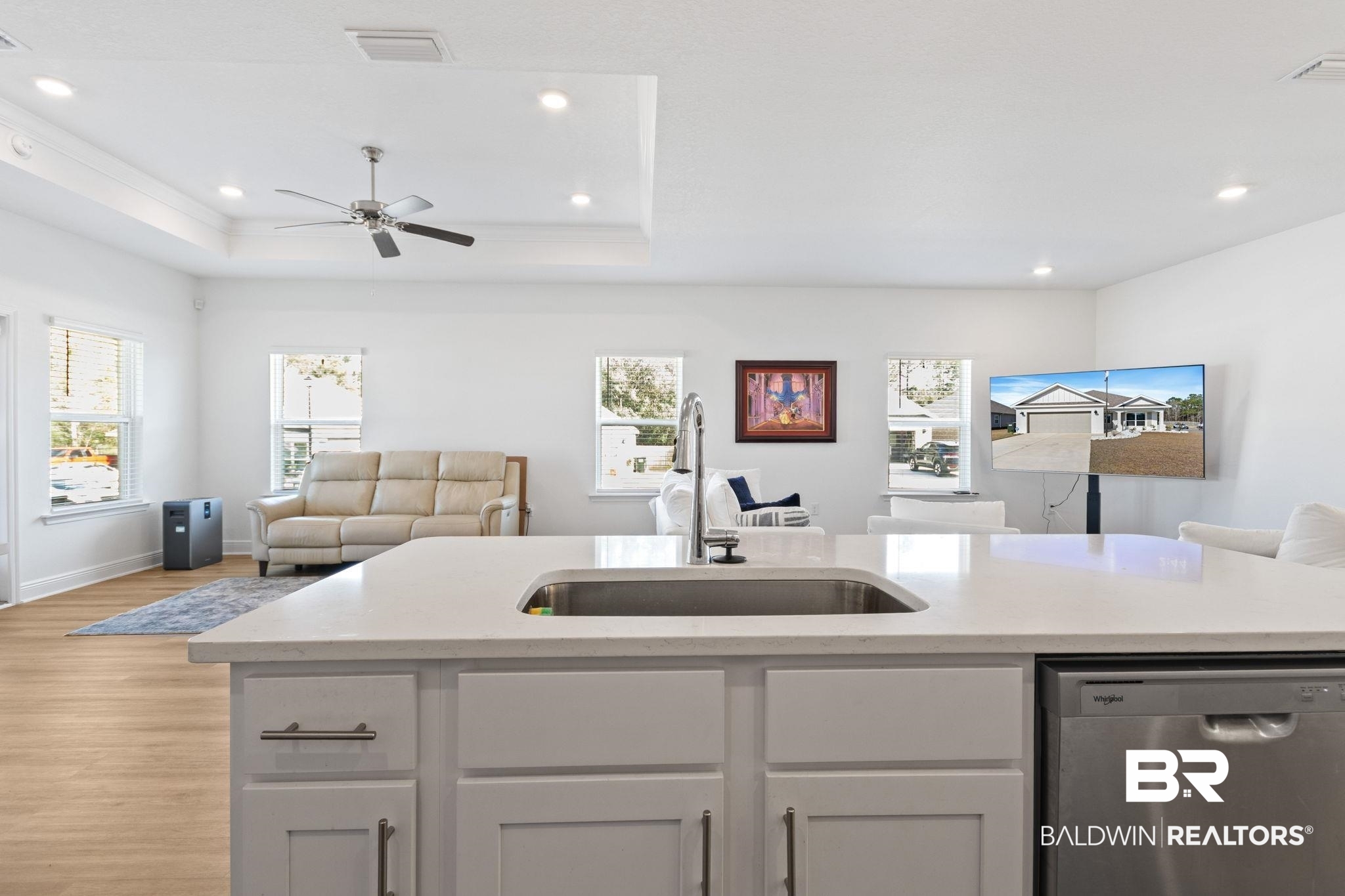 12919 Torrent Road Fairhope, AL 36532 - Photo 74 of 74 Kitchen with open floor plan, dishwasher, white cabinetry, a ceiling fan, and light stone countertops