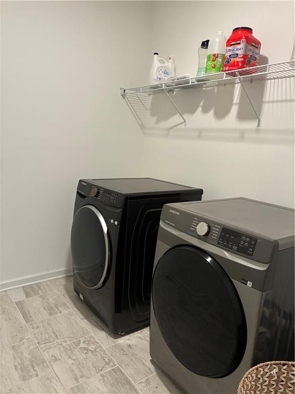3660 Andover Street Cumming, GA 30028 - Photo 19 of 36 a utility room with dryer and washer