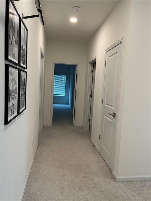 3660 Andover Street Cumming, GA 30028 - Photo 22 of 36 a view of a hallway with wooden floor and closet