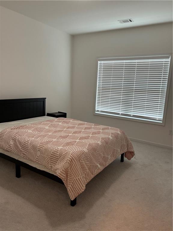 3660 Andover Street Cumming, GA 30028 - Photo 23 of 36 a bedroom with a bed and a window