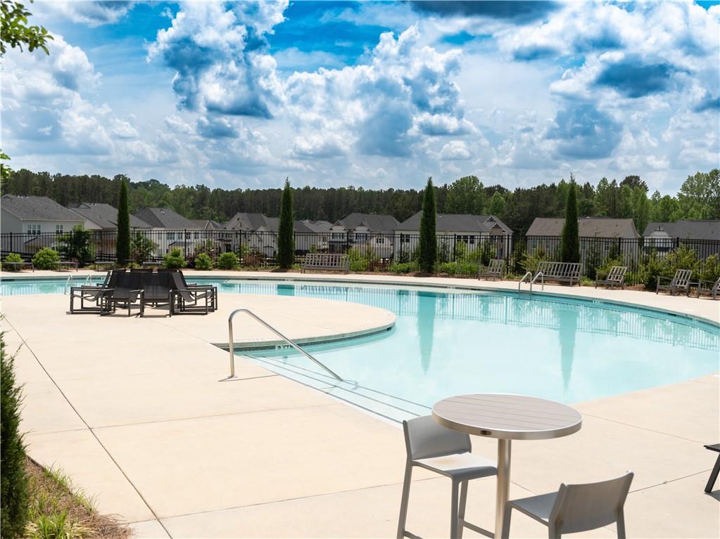 3660 Andover Street Cumming, GA 30028 - Photo 33 of 36 a view of swimming pool with a table and chairs