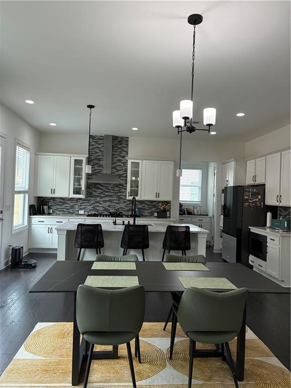 3660 Andover Street Cumming, GA 30028 - Photo 8 of 36 a kitchen with a dining table chairs and kitchen view