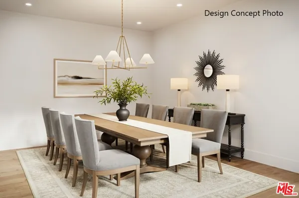 a view of a dining room with furniture and chandelier