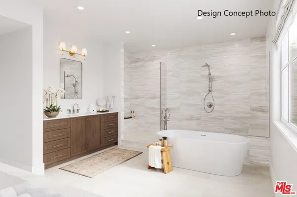 a bathroom with a tub sink and mirror