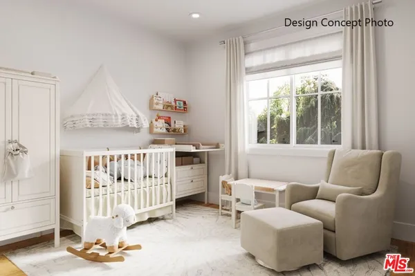 a bedroom with furniture and a large window