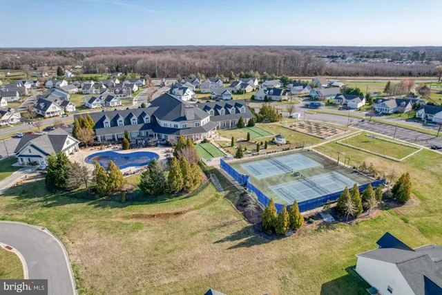 an aerial view of a chairs and table in the patio