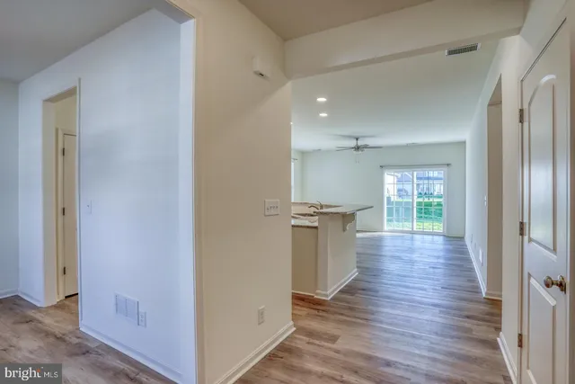 a view of a kitchen cabinets wooden floor and a window
