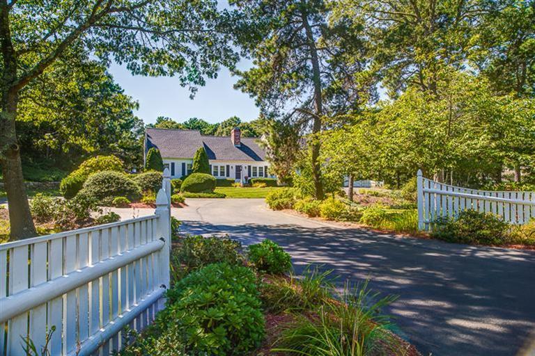 1136 Old Post Road Cotuit, MA 02635 - Photo 2 of 20 a view of swimming pool from a garden