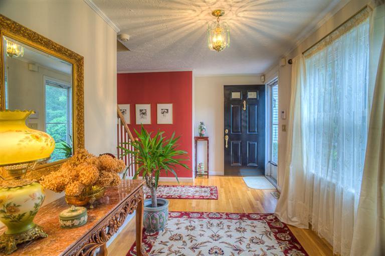 1136 Old Post Road Cotuit, MA 02635 - Photo 3 of 20 a very nice looking bedroom with wooden floor and a chandelier