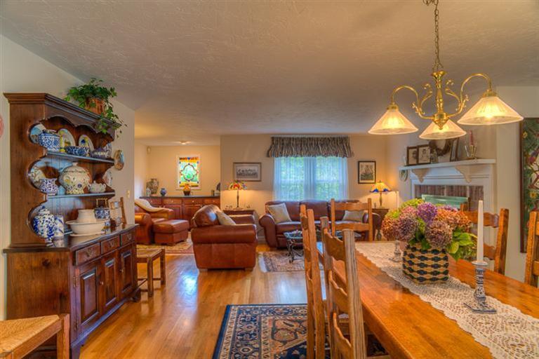 1136 Old Post Road Cotuit, MA 02635 - Photo 8 of 20 a living room with fireplace furniture and a chandelier