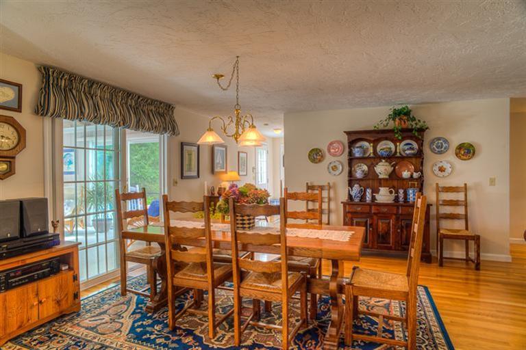 1136 Old Post Road Cotuit, MA 02635 - Photo 9 of 20 a view of a dining room with furniture and wooden floor