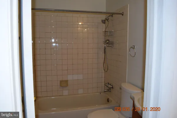 a bathroom with a shower and a toilet