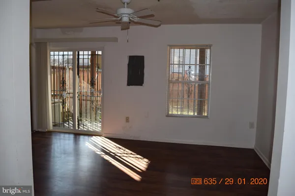 an entryway with wooden floor