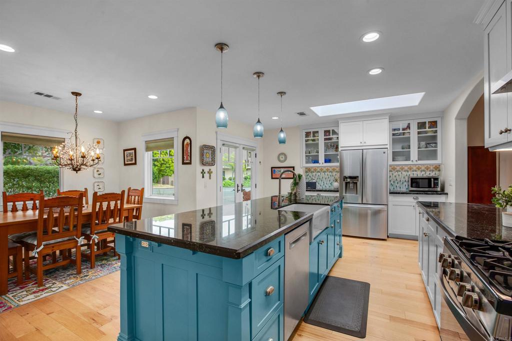 1503 Ridgeway Street Oceanside, CA 92054 - Photo 11 of 56 a kitchen with stainless steel appliances granite countertop a sink stove and refrigerator