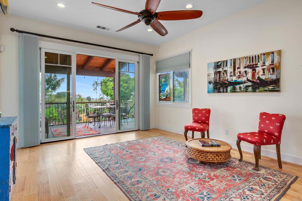 1503 Ridgeway Street Oceanside, CA 92054 - Photo 13 of 56 a living room with furniture and a floor to ceiling window