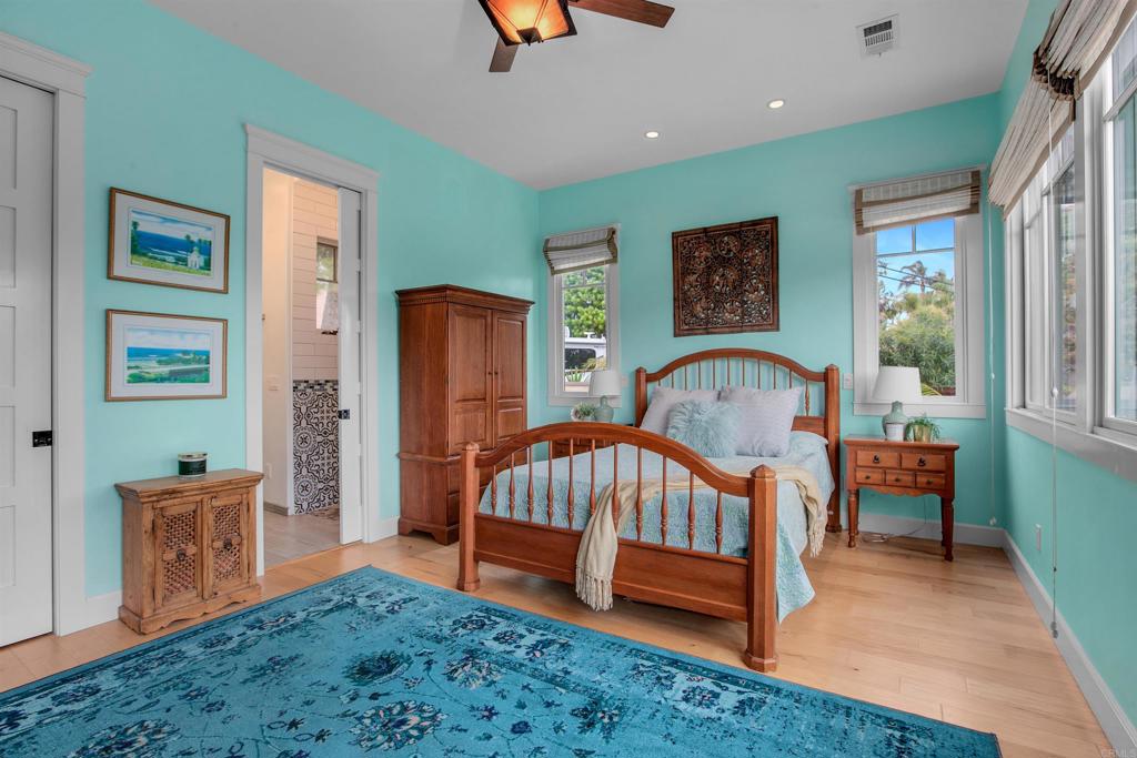 1503 Ridgeway Street Oceanside, CA 92054 - Photo 17 of 56 a bedroom with a bed and a view of bathroom
