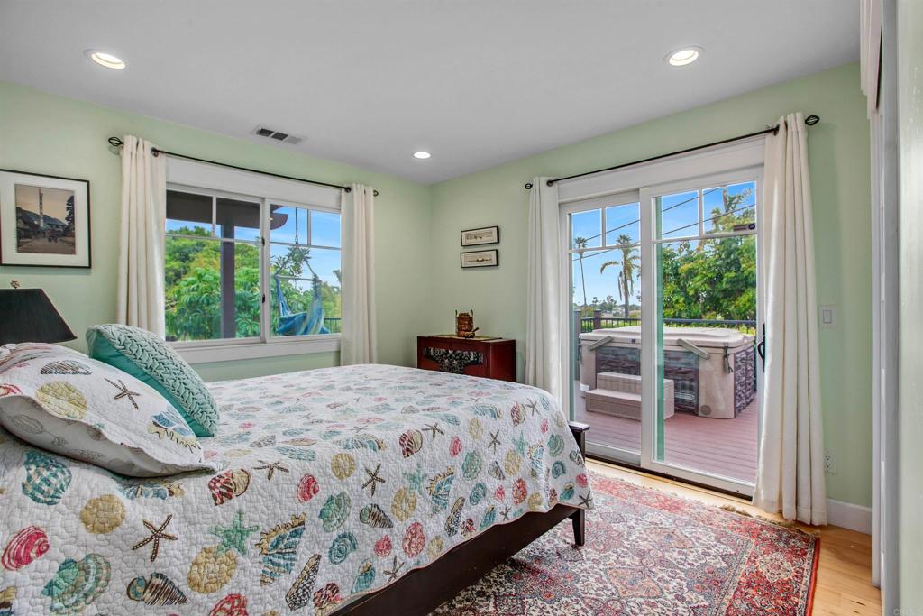 1503 Ridgeway Street Oceanside, CA 92054 - Photo 21 of 56 a bedroom with a bed and a large window