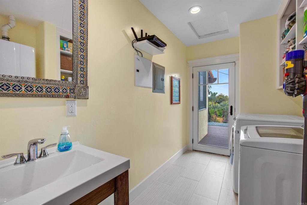 1503 Ridgeway Street Oceanside, CA 92054 - Photo 24 of 56 a bathroom with a sink and a mirror