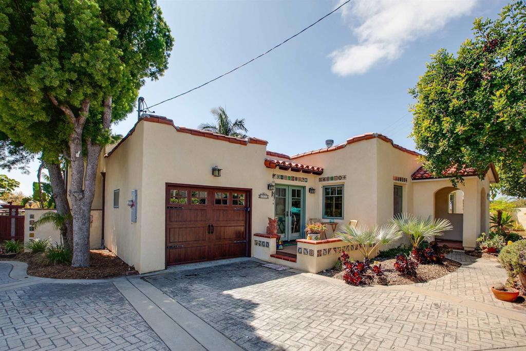 1503 Ridgeway Street Oceanside, CA 92054 - Photo 29 of 56 a view of a patio with a table and chairs under an umbrella