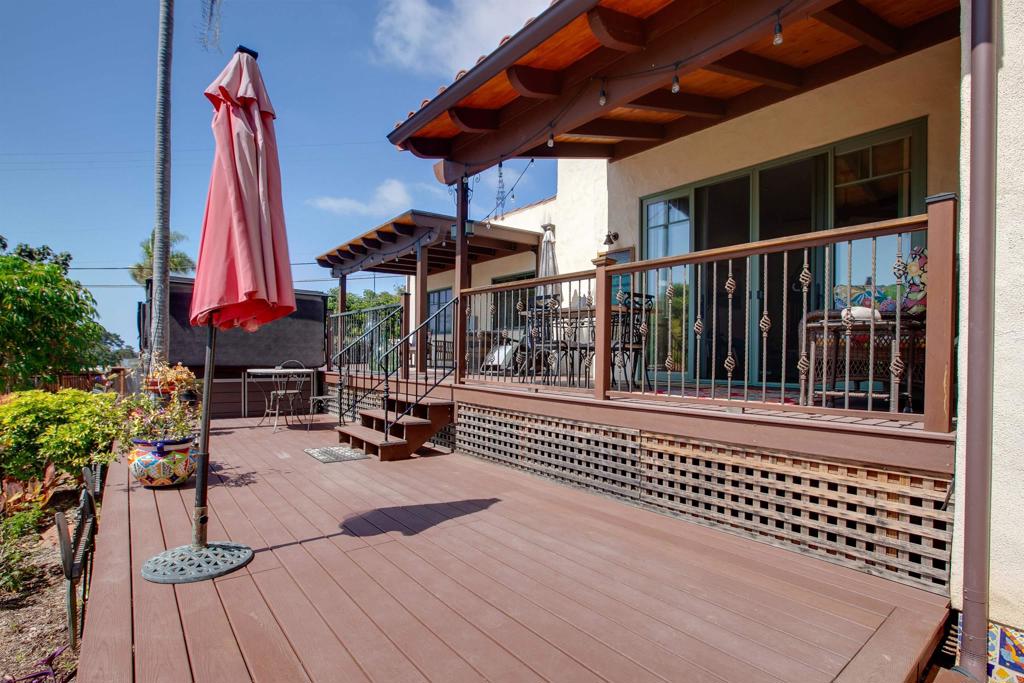 1503 Ridgeway Street Oceanside, CA 92054 - Photo 33 of 56 a view of a chair and tables in the patio in front of a house