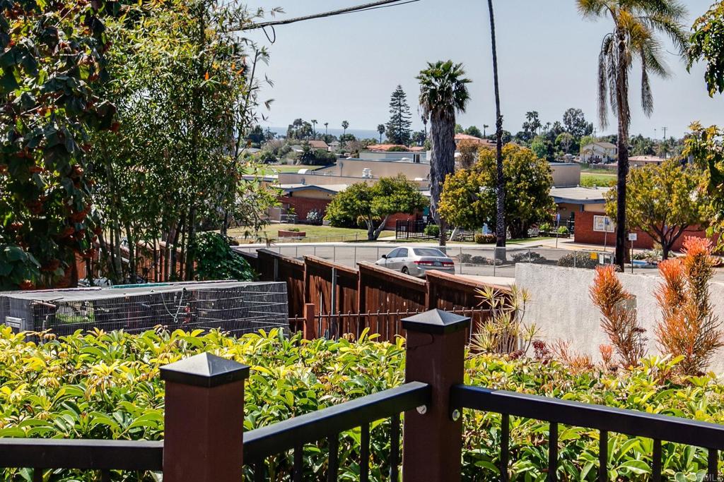 1503 Ridgeway Street Oceanside, CA 92054 - Photo 41 of 56 a view of a swimming pool with a deck and a garden