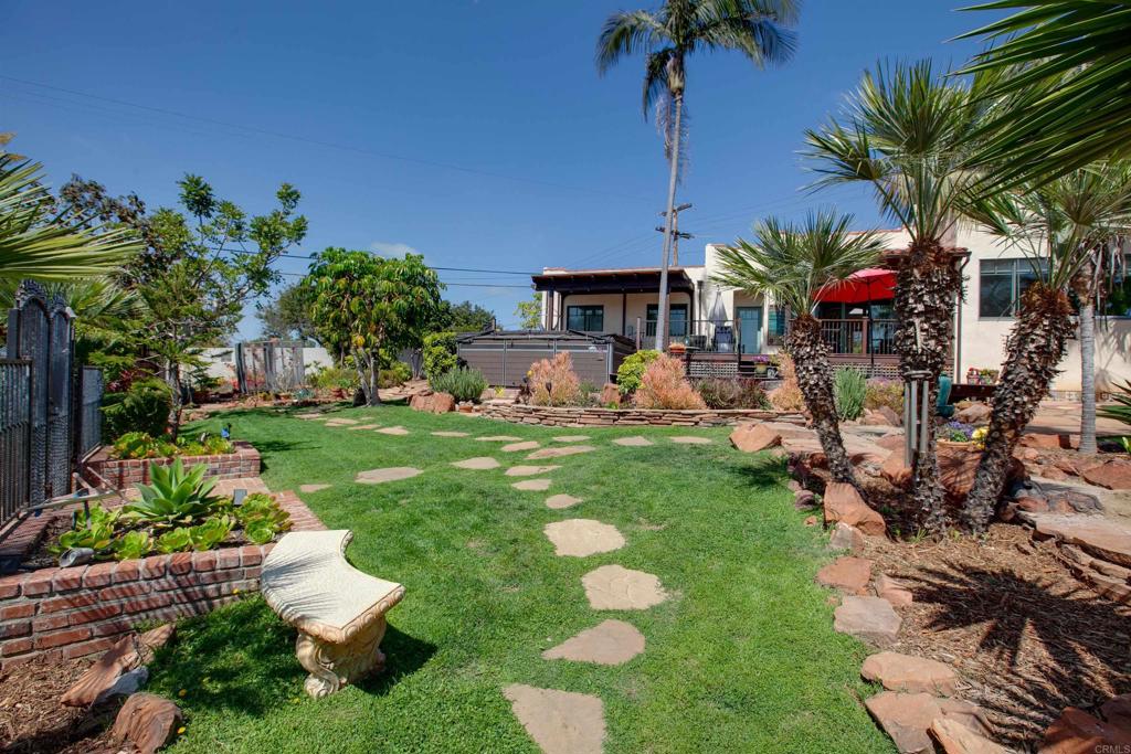 1503 Ridgeway Street Oceanside, CA 92054 - Photo 44 of 56 a front view of a house with garden