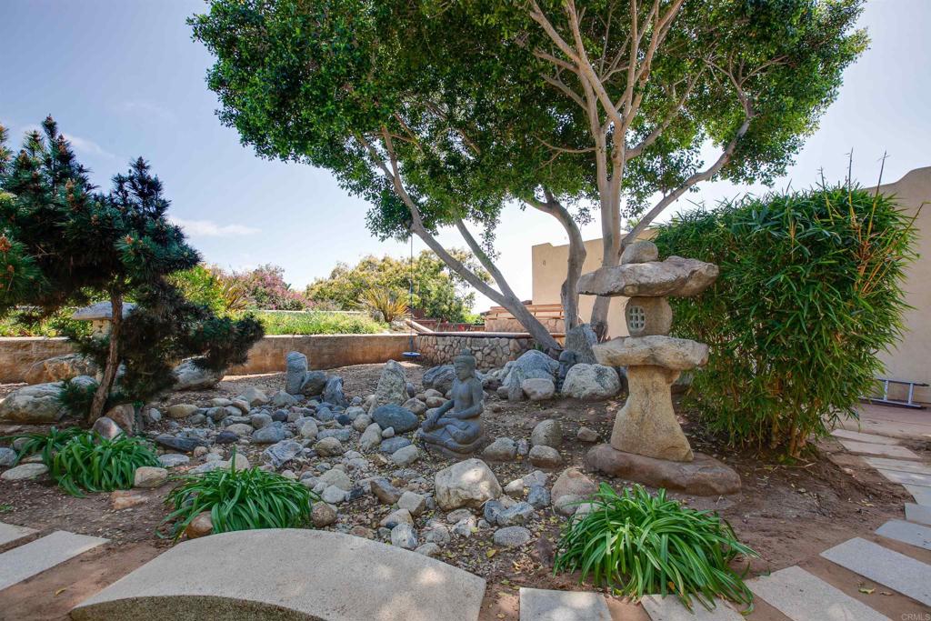 1503 Ridgeway Street Oceanside, CA 92054 - Photo 47 of 56 a view of a house with a yard and a tree