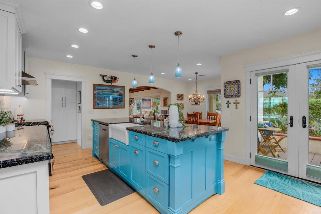 1503 Ridgeway Street Oceanside, CA 92054 - Photo 8 of 56 a kitchen with stainless steel appliances kitchen island granite countertop a sink and cabinets