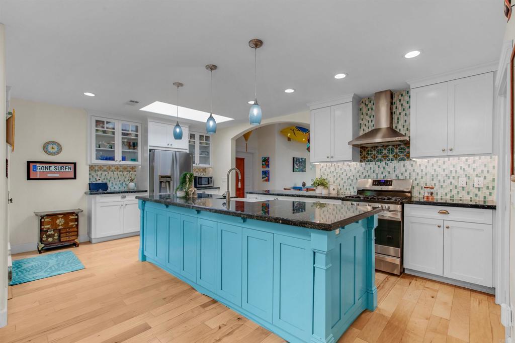 1503 Ridgeway Street Oceanside, CA 92054 - Photo 10 of 56 a kitchen with stainless steel appliances granite countertop a sink and cabinets