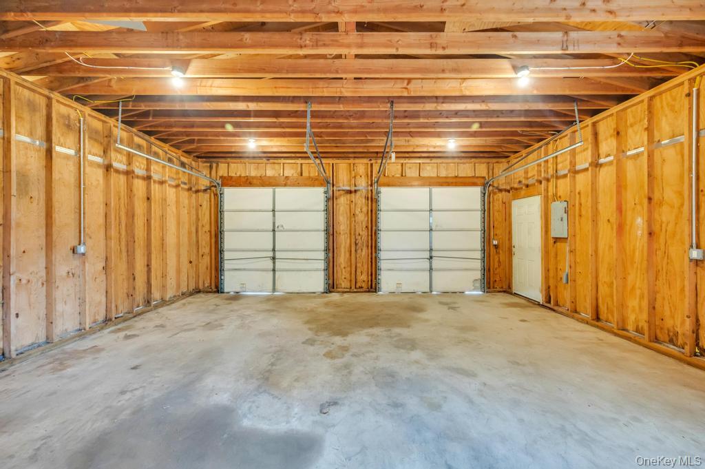 491 Hawkins Road Selden, NY 11784 - Photo 43 of 50 Two car garage with concrete flooring, and ceiling-mounted lighting fixtures