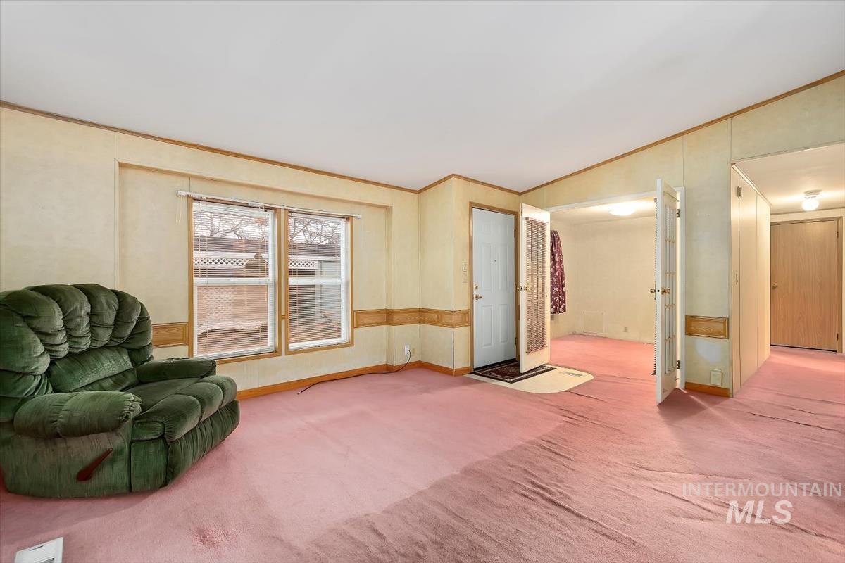 2804 Golden Rod Lane Caldwell, ID 83605 - Photo 14 of 35 Sitting room with carpet and crown molding