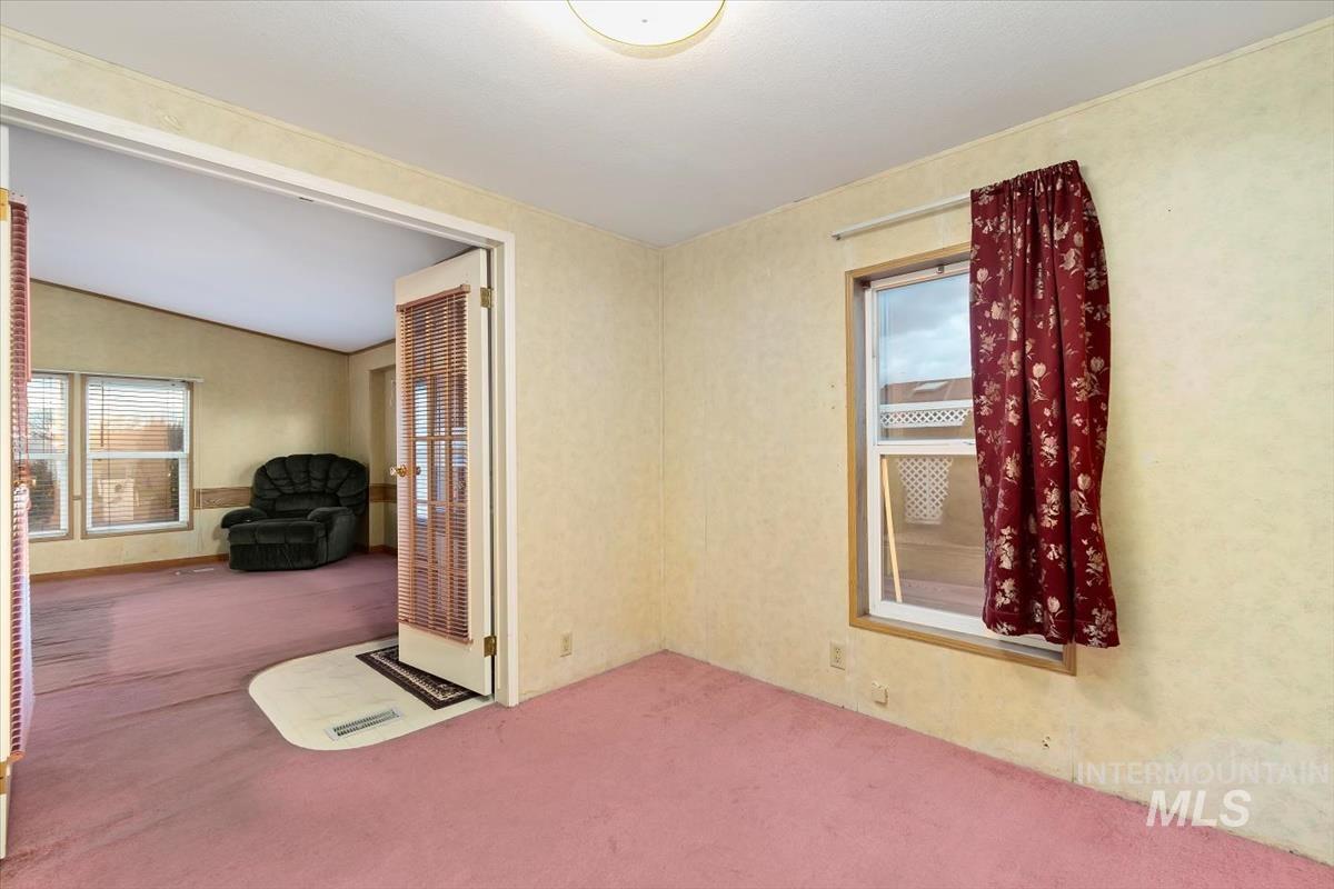 2804 Golden Rod Lane Caldwell, ID 83605 - Photo 16 of 35 Carpeted empty room featuring lofted ceiling